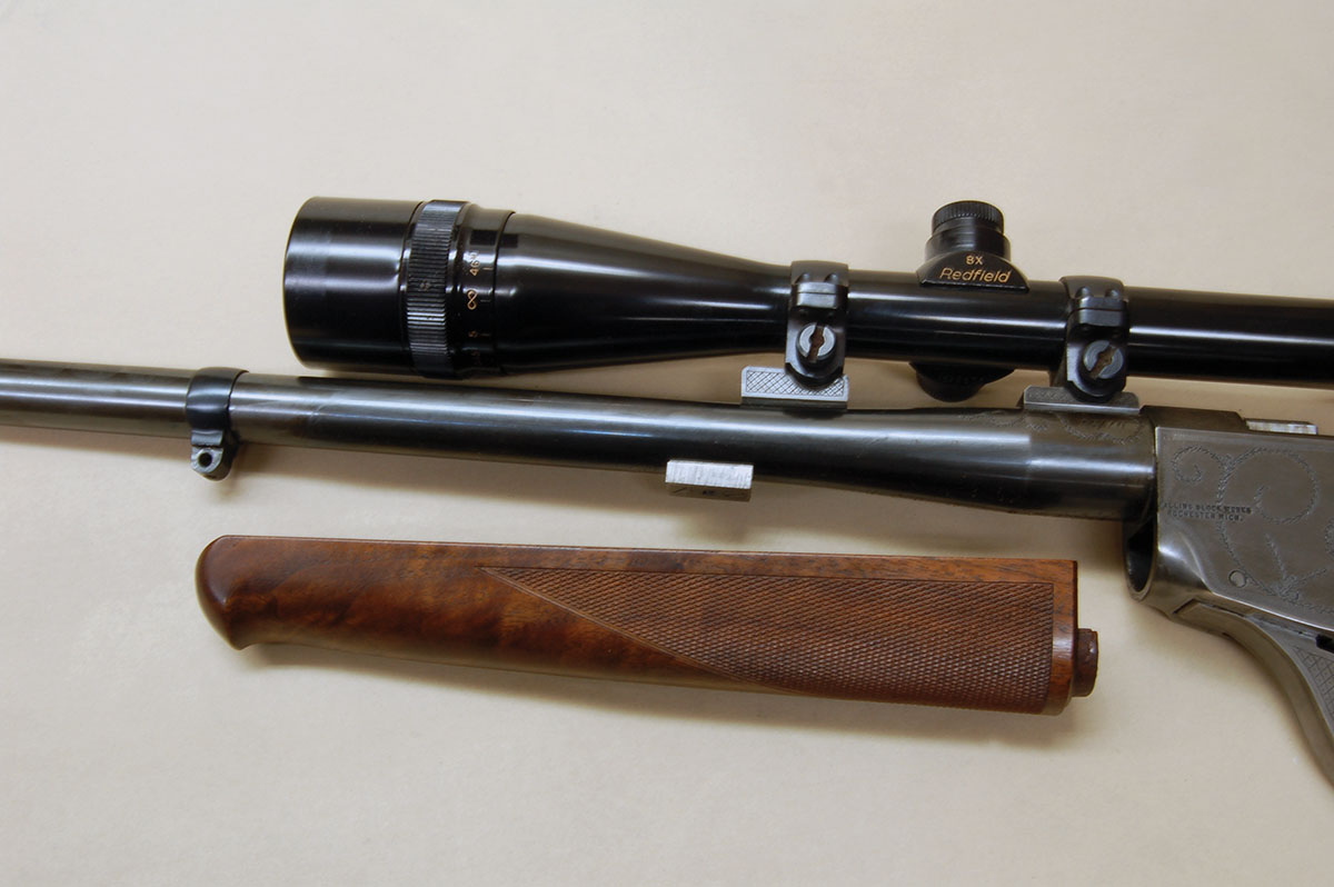The barrel block attaches the forearm to the barrel while a large tenon at the rear of the wood fits into the front of the action.